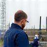 Engineer at site using signal-measuring equipment
