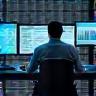 Team performing network analysis on computers